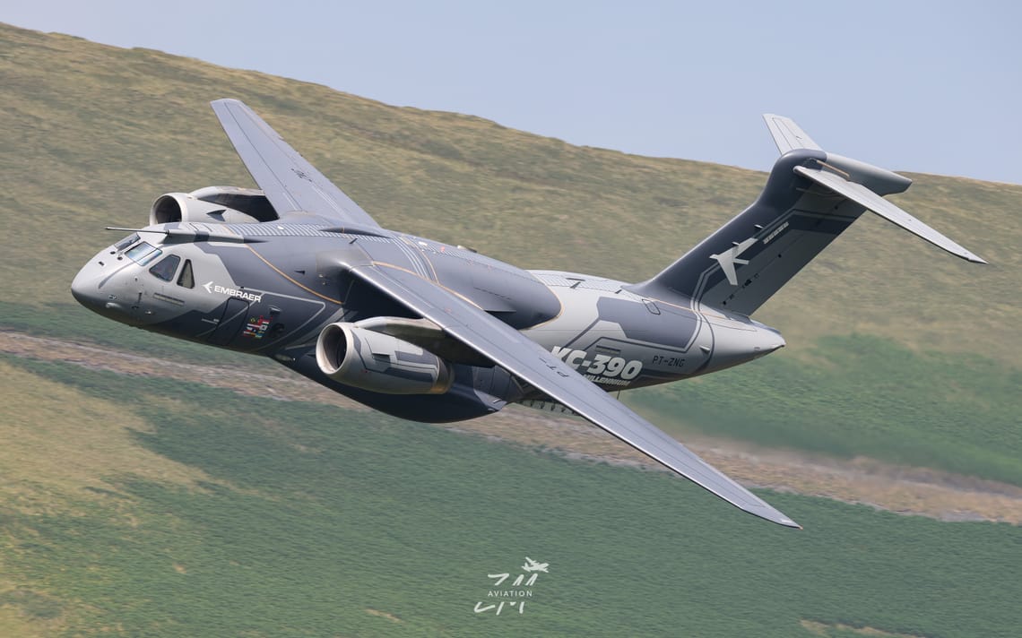 Embraer flagship and Spitfire formation pair in LFA7