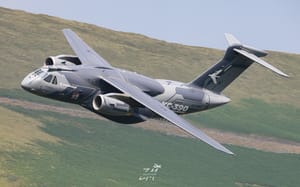 Embraer flagship and Spitfire formation pair in LFA7